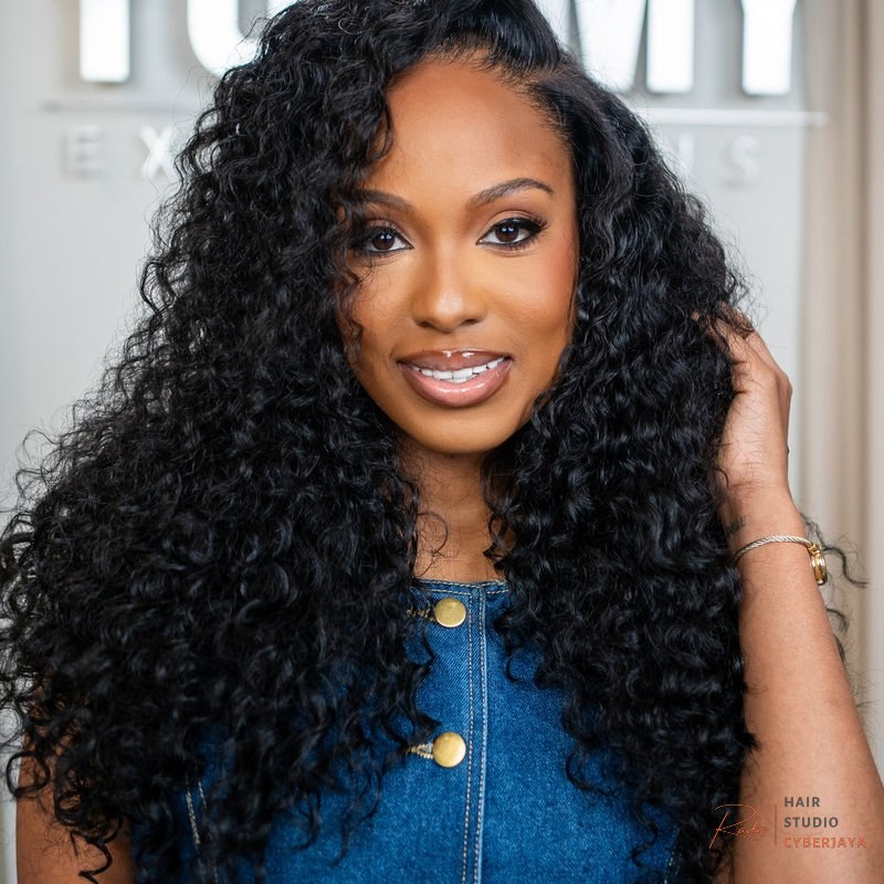 YUMMY Raw Burma Curly A YUMMY Raw Burma Curly hair extension, highlighting its natural volume and vibrant curl definition.