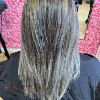 A vibrant interior of a hair salon, showcasing a comfortable and inviting atmosphere for clients seeking a hair salon new image.
