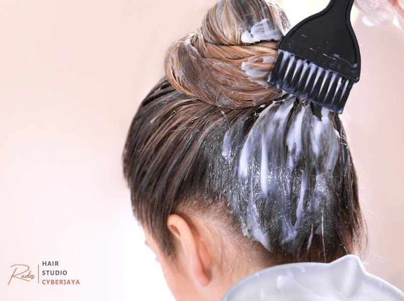 Woman Getting Hair Bleached How often do you dye your hair when getting highlights or balayage?