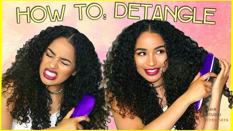 HOW TO DETANGLE CURLY HAIR - Minimum Breakage + MAX HAIR GROWTH A hand demonstrating detangling curly hair from the ends upwards