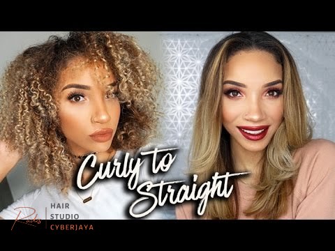 Straighten Curly Hair Fast Techniques A person demonstrating how to straighten curly hair fast