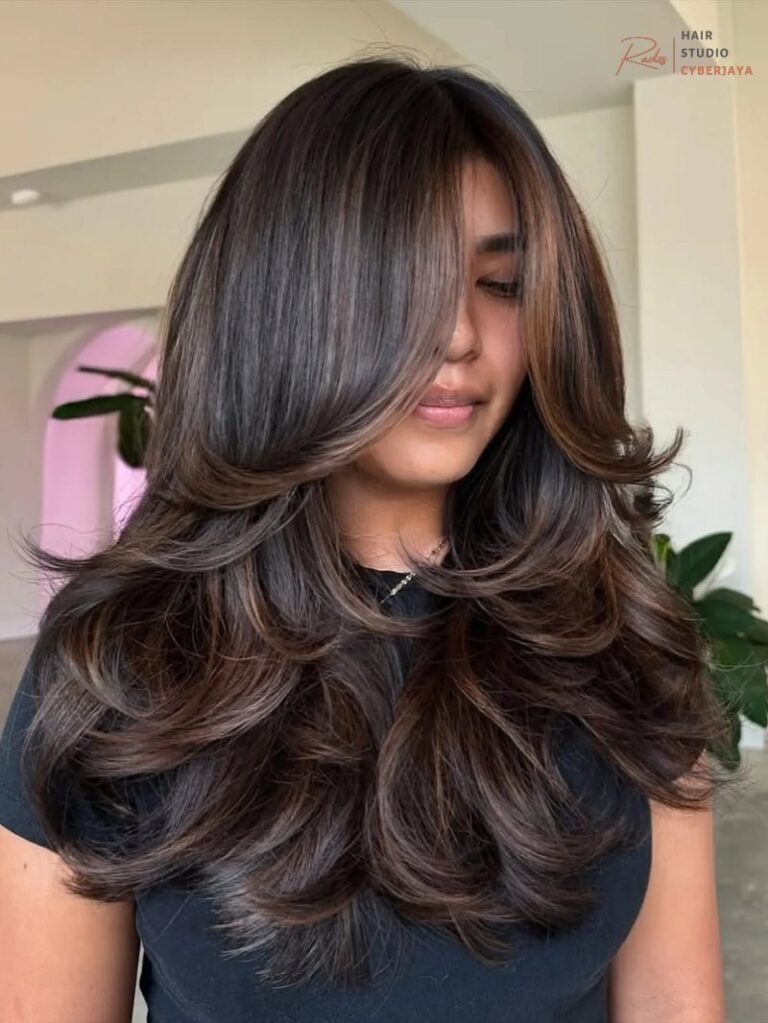 Woman with long, wavy mocha dark chocolate brown hair