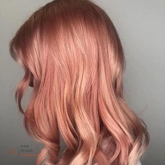 Rose Gold Hair: The Trend That Keeps Coming Back Long wavy rose gold hair created by Wella Professionals
