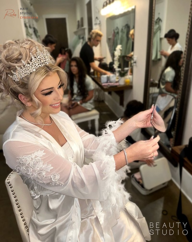 Bride's elegant bridal hair styling in progress A bride getting ready with her bridal hair styled